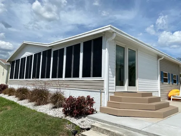 Acrylic lanai four seasons room with custom built deck stairs